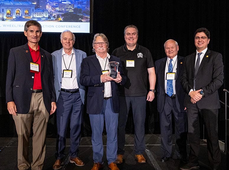 Mike Roney receives the Worth Award at WRI 2025